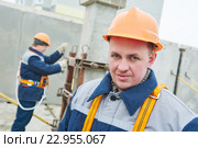 Construction worker. Builders concreter joiners at work. Стоковое фото, фотограф Дмитрий Калиновский / Фотобанк Лори