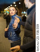 Couple having quarrel in evening outdoors. Стоковое фото, фотограф Яков Филимонов / Фотобанк Лори