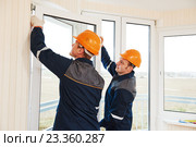 workers installing window. Стоковое фото, фотограф Дмитрий Калиновский / Фотобанк Лори