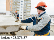 Construction worker. Builders concreter joiners at work. Стоковое фото, фотограф Дмитрий Калиновский / Фотобанк Лори