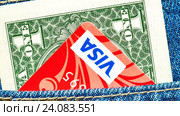 One american dollar and Credit card Visa sticking out of the back jeans pocket. Редакционная анимация, аниматор FotograFF / Фотобанк Лори