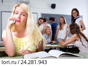 Crying outcast student in college classroom. Стоковое фото, фотограф Яков Филимонов / Фотобанк Лори