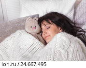 Girl sleeps in a bed with a toy a teddy bear. Стоковое фото, фотограф ElenArt / Фотобанк Лори