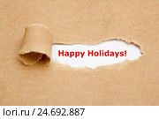 Надпись Happy Holidays на рваной бумаге. Стоковое фото, фотограф Ивелин Радков / Фотобанк Лори
