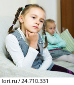 Offended girls sitting apart at home. Стоковое фото, фотограф Яков Филимонов / Фотобанк Лори