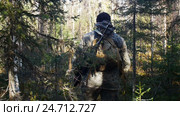 Man hunter outdoor in forest hunting alone. Стоковое видео, видеограф Сергей Кальсин / Фотобанк Лори