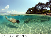 Split level, the man diving, Cleopatra island (Sedir Island), Aegean Sea, Turkey (2012 год). Редакционное фото, фотограф Некрасов Андрей / Фотобанк Лори