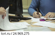 The signing of the project by one of the business transaction. The second partner to view documents. Стоковое видео, видеограф Артём Зайцев / Фотобанк Лори