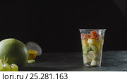 Slices of Grapefruit Add a Fruit Cocktail Cup. Стоковое видео, видеограф Станислав Панкратов / Фотобанк Лори