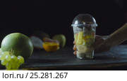 Chef picks up a Exotic Fruit Cocktail From the Table. Стоковое видео, видеограф Станислав Панкратов / Фотобанк Лори