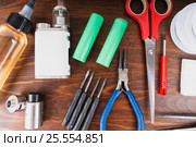 Set to vape. Tools, candy, liquid, RDA, RTA. Стоковое фото, фотограф Сергей Лабутин / Фотобанк Лори
