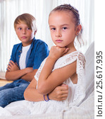 Offended little girl and teenager indoors. Стоковое фото, фотограф Яков Филимонов / Фотобанк Лори