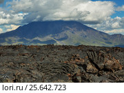 Lava field at Tolbachik volcano, after eruption in 2012 on background Big Udina volcano, Kamchatka (2016 год). Редакционное фото, фотограф Юлия Машкова / Фотобанк Лори