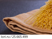 Uncooked pasta on a cloth. Стоковое фото, фотограф Дегтярева Виктория / Фотобанк Лори
