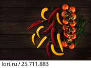 Yellow and red chili peppers on a wooden dark background. Free inscription. Стоковое фото, фотограф Татьяна Дубчук / Фотобанк Лори
