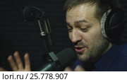 Presenter or host in radio station hosting show for radio live in Studio. Стоковое видео, видеограф Виктор Аллин / Фотобанк Лори