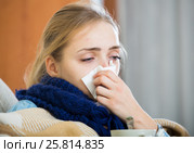 Adult female under blanket with flu attack indoors. Стоковое фото, фотограф Яков Филимонов / Фотобанк Лори
