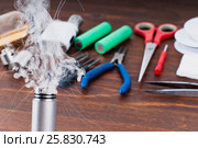 Check RDA. Set to vape. Tools, cotton, liquid, RDA, RTA. Стоковое фото, фотограф Сергей Лабутин / Фотобанк Лори