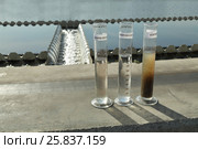 Example, how looks water inlet and sedimentation after purification, text on tubes: received, tap, purified. Стоковое фото, фотограф Losevsky Pavel / Фотобанк Лори