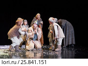 MOSCOW, RUSSIA - JAN 15, 2015: Group of children and God fool on square in front od Cathedral on stage of Moscow theatre Et Cetera in play Boris Godunov directed by Peter Stein. Редакционное фото, фотограф Losevsky Pavel / Фотобанк Лори
