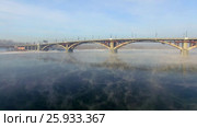 Аэрофотосъемка с воздуха. Зима. Город Иркутск. Россия. Сибирь. Вид на мост через реку Ангара (2017 год). Стоковое видео, видеограф Виталий Зверев / Фотобанк Лори