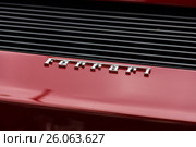 BERLIN - JUNE 14, 2015: Emblem of the sports car Ferrari Testarossa (Type F110). The Classic Days on Kurfuerstendamm. Редакционное фото, фотограф Sergey Kohl / Фотобанк Лори