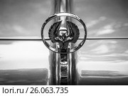 BERLIN - JUNE 14, 2015: Hood ornament of a luxury car Imperial Custom 4-door Southampton, 1961. Black and white. The Classic Days on Kurfuerstendamm. Редакционное фото, фотограф Sergey Kohl / Фотобанк Лори
