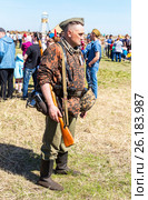 Unidentified member of Historical reenactment in German Army uniform during historical reenactment of battlefield in 1943 in summer day (2017 год). Редакционное фото, фотограф FotograFF / Фотобанк Лори