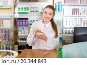 Smiling cheerful young female pharmacist posing. Стоковое фото, фотограф Яков Филимонов / Фотобанк Лори