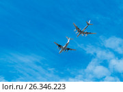 RUSSIA, SARATOV - MAY 6, 2017: Air tanker Ilyushin IL-78 and Strategic bomber Tu-95 "Bear" simulate in-flight refueling at Parade of Victory in World War II. Russian planes. Редакционное фото, фотограф Sergey Borisov / Фотобанк Лори