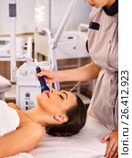Ultrasonic facial treatment on ultrasound man face machine. Стоковое фото, фотограф Gennadiy Poznyakov / Фотобанк Лори