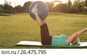 Adult woman making exercise with fitball in park. Стоковое видео, видеограф Швец Анастасия / Фотобанк Лори