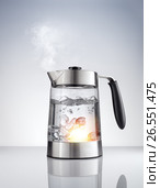 Close up view of nice metal tea kettle on grey color background. Стоковое фото, фотограф Дмитрий Эрслер / Фотобанк Лори