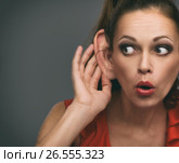 shocked girl overhearing someone. Стоковое фото, фотограф Александр Лычагин / Фотобанк Лори