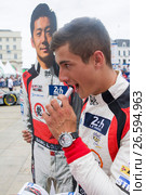 LE MANS, FRANCE - JUNE 16, 2017: Thomas Laurent french pilot with team of Jackie Chan DC racing Oreca 07-Gibson. Winner of races 24 hours Le Mans LMP2 2017.Parade of pilots racing at Le mans, France. Редакционное фото, фотограф Irina Kuchugurina/Gaudy / Фотобанк Лори
