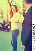 Woman stopping man bothering her. Стоковое фото, фотограф Яков Филимонов / Фотобанк Лори