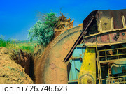 Колесо роторного экскаватора. Роторный экскаватор в работе. (2017 год). Стоковое фото, фотограф Роман Румянцев / Фотобанк Лори