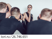 Photographers paparazzi take photos of woman in cocktail dresses. Стоковое фото, фотограф Женя Канашкин / Фотобанк Лори
