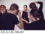 Photographers paparazzi take photos of woman in cocktail dresses. Стоковое фото, фотограф Женя Канашкин / Фотобанк Лори