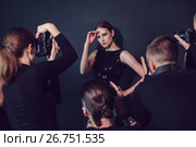 Photographers paparazzi take photos of beautiful woman in cocktail dresses. Стоковое фото, фотограф Женя Канашкин / Фотобанк Лори