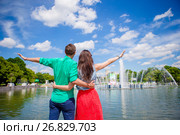 Young tourist couple traveling on holidays in Europe smiling happy. Caucasian girl and man background of fountain. Стоковое фото, фотограф Дмитрий Травников / Фотобанк Лори