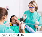 Terrified client in dental clinic. Стоковое фото, фотограф Яков Филимонов / Фотобанк Лори