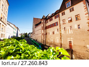 Green tram at the narrow street of Basel old town (2017 год). Стоковое фото, фотограф Сергей Новиков / Фотобанк Лори