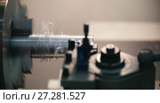 Cutting of metal parts on the lathe machine at the factory, metal shavings, industrial concept, profile view. Стоковое видео, видеограф Константин Шишкин / Фотобанк Лори