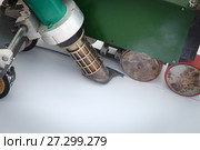 Waterproofing and insulation at construction site, roof sealing process of synthetic membrane with Automatic plastic welder. New protection technology. Closeup. Стоковое фото, фотограф Сергей Дорошенко / Фотобанк Лори