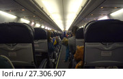 Moscow, Russian Federation – March 19, 2017: Interior of airplane with passengers on seats. Редакционное видео, видеограф Курганов Александр / Фотобанк Лори