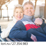 Smiling mature couple relaxing in park. Стоковое фото, фотограф Яков Филимонов / Фотобанк Лори