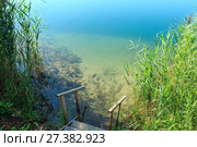 Summer lake calm beach with wood steeps to the water. Стоковое фото, фотограф Юрий Брыкайло / Фотобанк Лори