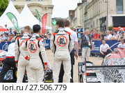 LE MANS, FRANCE - JUNE 11, 2017: Team of Jackie Chan DC racing Oreca 07-Gibson and race car at the Parade of pilots racing. Редакционное фото, фотограф Irina Kuchugurina/Gaudy / Фотобанк Лори
