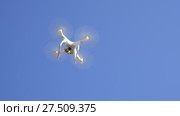 Drone DJI Phantom 4 in flight. Quadrocopter against the blue sky with white clouds. The flight of the copter in the sky. Стоковое видео, видеограф Леонид Еремейчук / Фотобанк Лори